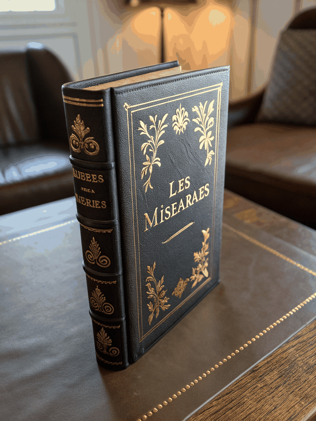 Antique leather-bound volume of Les Misérables by Victor Hugo
